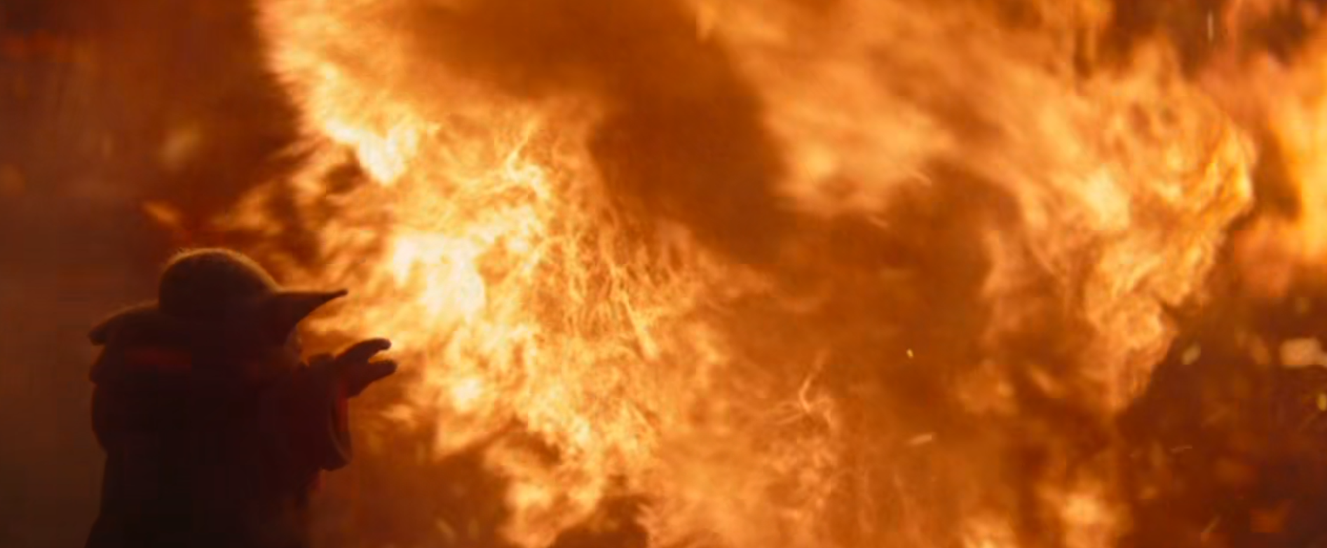 The meme is an image of a character from the Star Wars franchise, specifically the young version of Anakin Skywalker/Darth Vader, known as "Baby Yoda" or "The Child" from the Disney+ series "The Mandalorian". The image depicts Baby Yoda holding a lightsaber and standing in front of a massive explosion, with flames and smoke surrounding him. The text overlaying the image is simply "Baby Yoda, 5 years old".